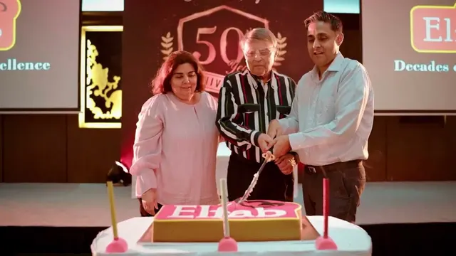 Cake cutting at Elfab's 50th anniversary celebration